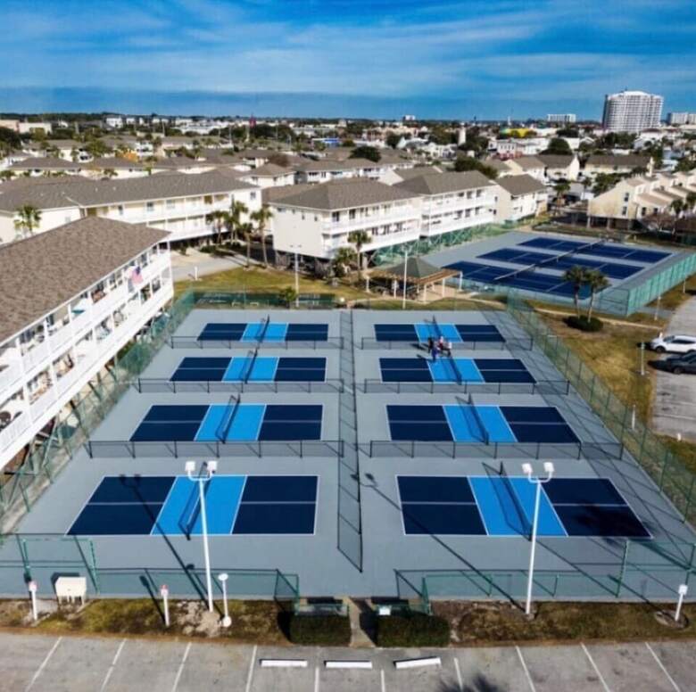 Aerial of eight pickleball courts and tennis courts at Sandpiper Cove